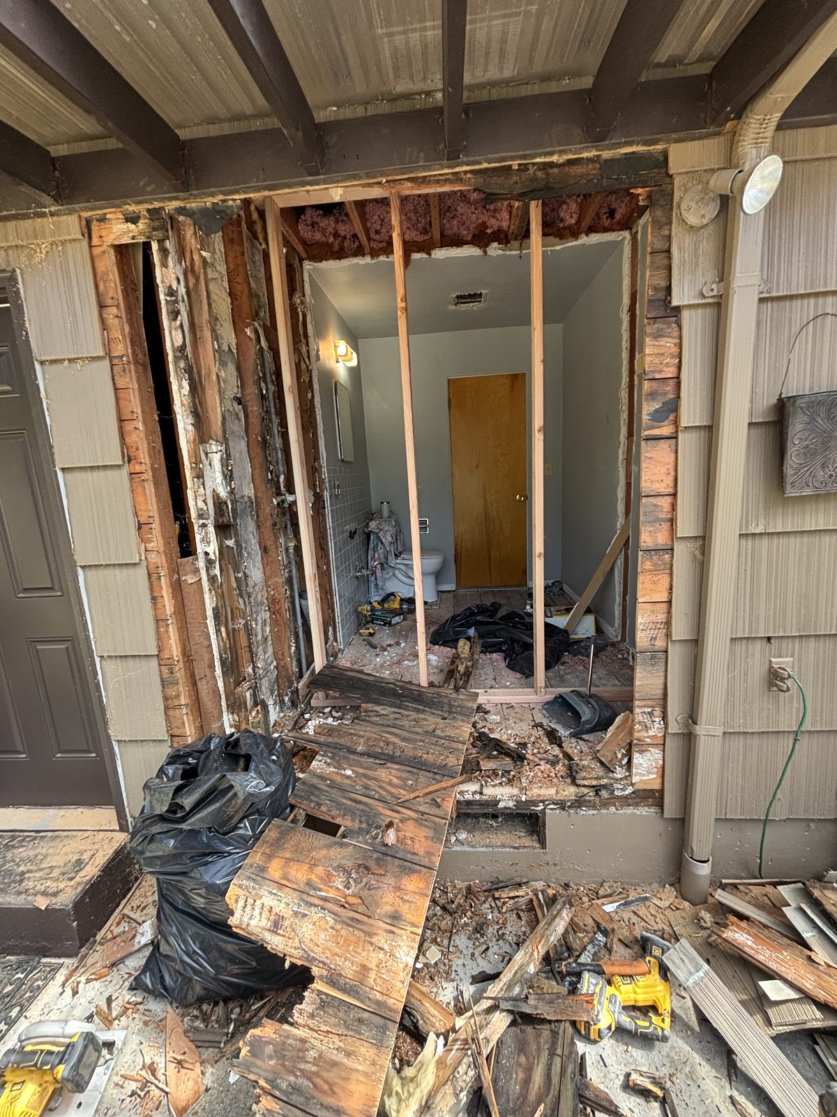 Exterior wall opened up to remove rotted sheathing